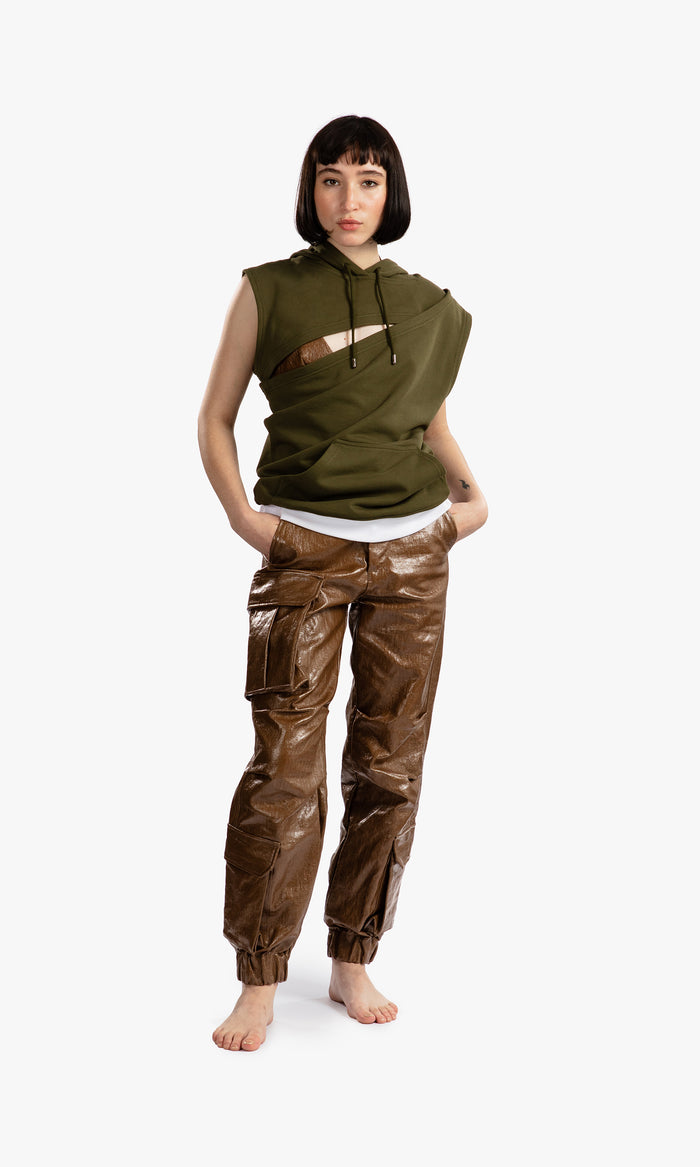 SIEGENTHALER | Front view of the HILDEGARD Hoodie in khaki fleece. Sleeveless and asymmetrical, with layered panels and a diagonal chest cutout. A sculptural take on casualwear with deconstructed lines and integrated kangaroo pocket.