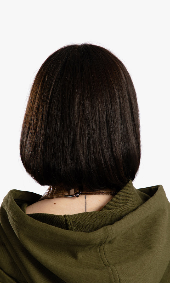 SIEGENTHALER | Back detail of the HILDEGARD Hoodie showing the hood structure and diagonal panel wrapping around the shoulders, merging streetwear with sculptural precision.