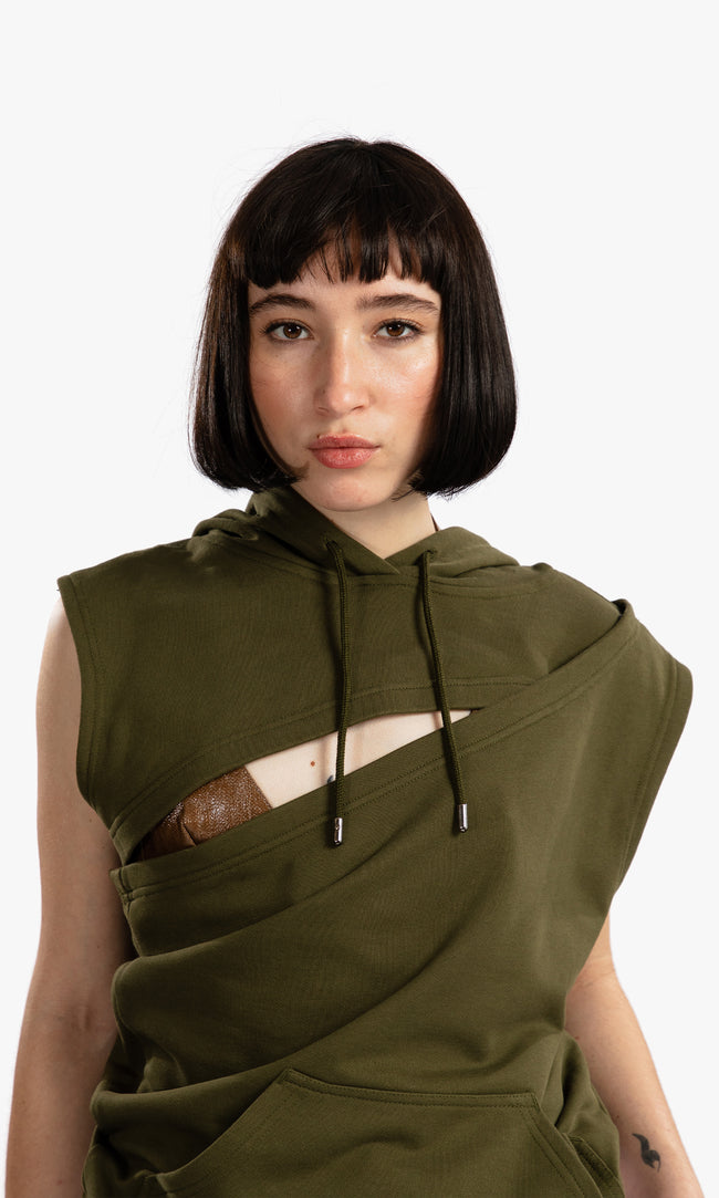 SIEGENTHALER | Close-up of the HILDEGARD Hoodie showing the diagonal neckline and layered chest cutout. The structured overlap and hood details frame the upper body with sharp contrast and sculptural flow.