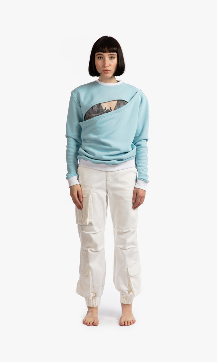 SIEGENTHALER | Front view of the unisex asymmetrical sweatshirt in porcelain blue, showcasing its two-piece design with cut-out details and classic fit in 100% cotton felpa.