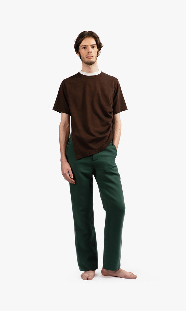SIEGENTHALER | Front view of unisex high-waisted tailored pants in dark green, showcasing a straight fit and concealed front zipper with invisible hook and button.