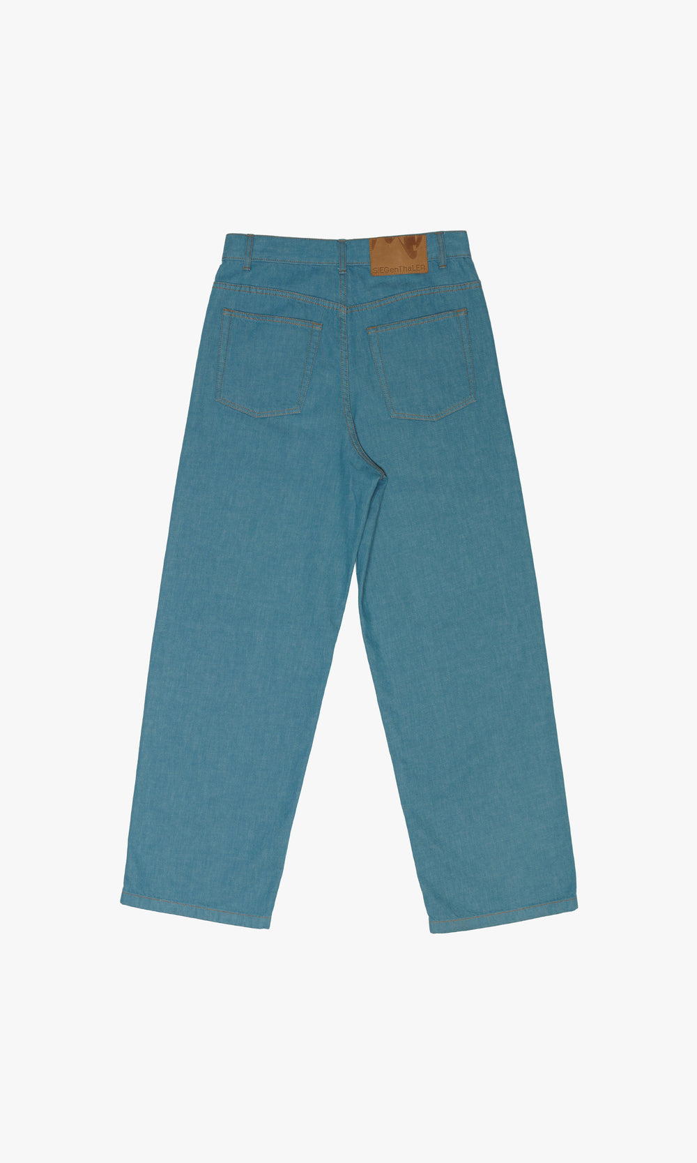 SIEGENTHALER | Rear view of Kraken Jeans in storm blue, featuring a Siegenthaler leather patch and beige topstitching for a refined finish.