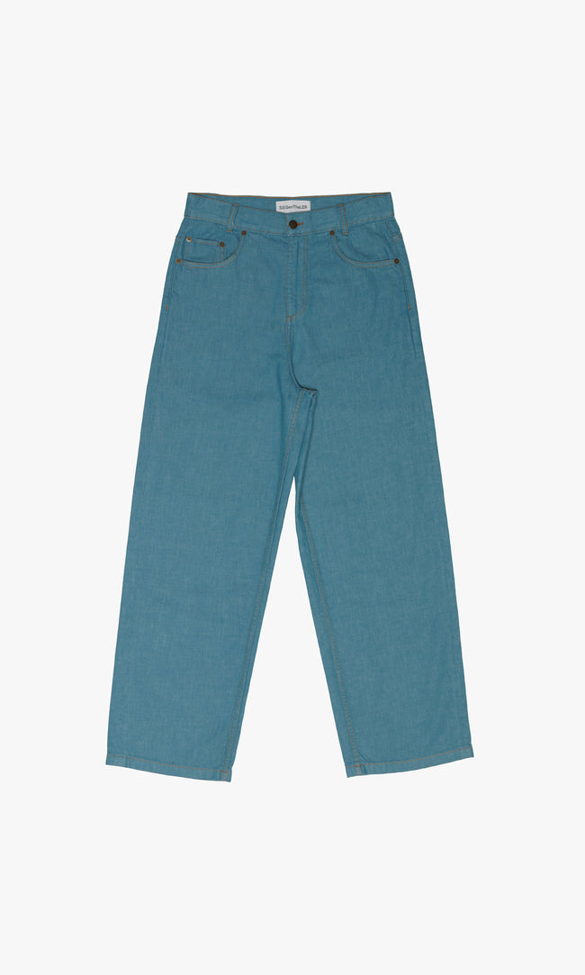 SIEGENTHALER | Front view of unisex high-waisted Kraken Jeans in storm blue, showcasing straight-cut silhouette and concealed front zipper with denim button on waistband.