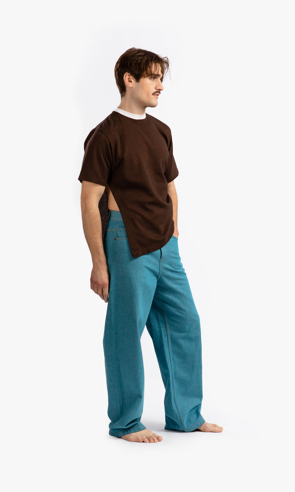 SIEGENTHALER | Side profile of Kraken Jeans in storm blue, highlighting the straight-leg design and eight belt loops at the waist for versatile styling.