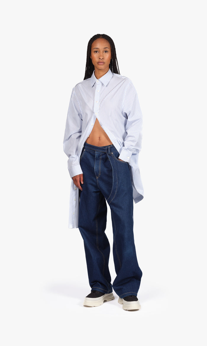 SIEGENTHALER | Front view of the shorts in light blue denim, featuring signature twisted fly and integrated belt with metal D-ring, cut just above the knee for a relaxed silhouette.