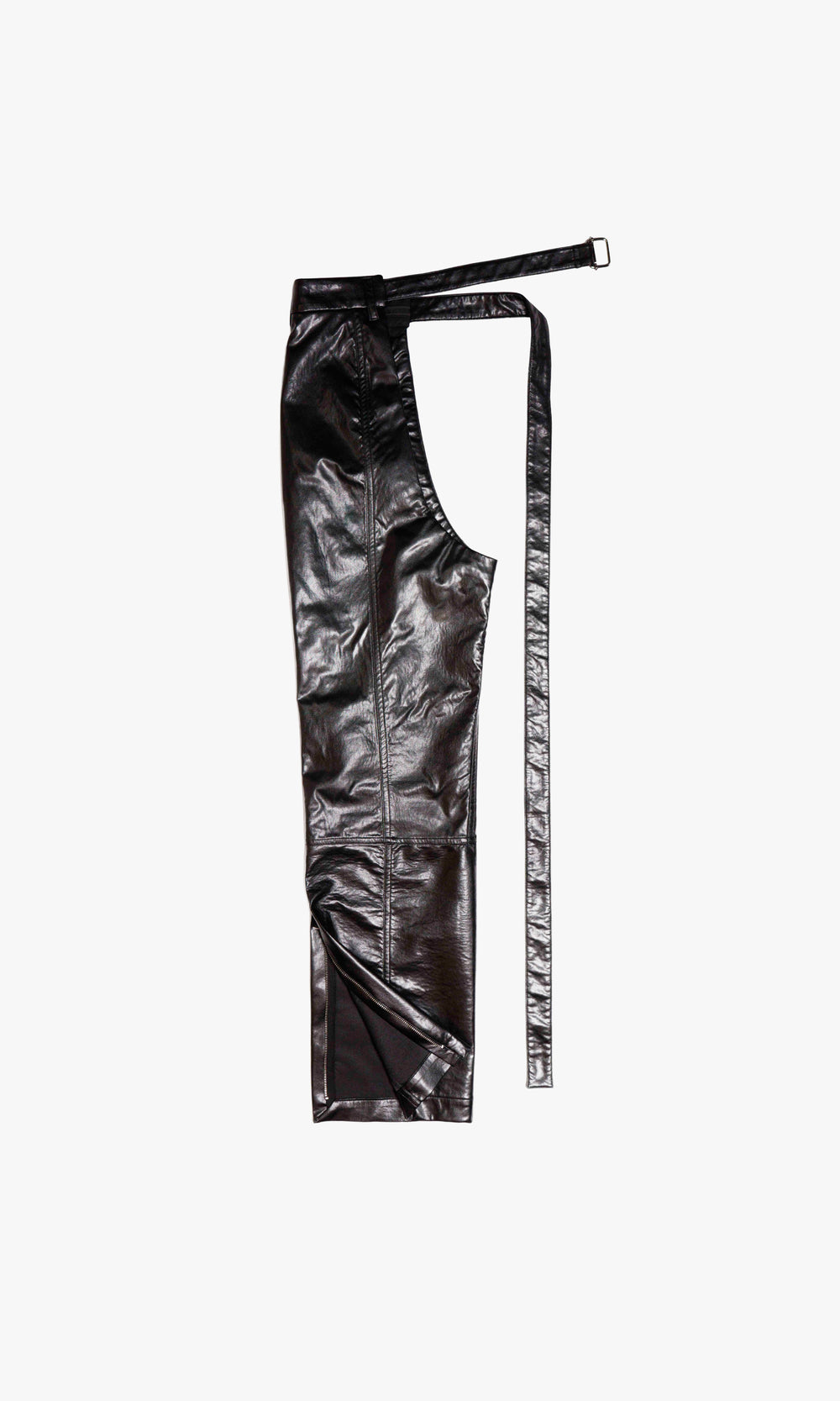  SIEGENTHALER | Back view of the CHAPP3 faux leather chaps reveals directional seamwork and tailored curvature for movement. Integrated belt strap allows custom closure and secure layering, showcasing the modular philosophy of the design.